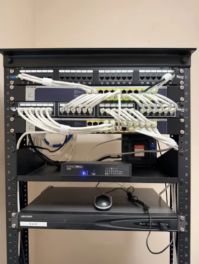 Network rack with SonicWALL firewall and structured cabling