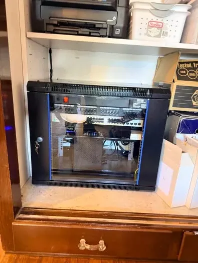 Wall-mounted network rack installation